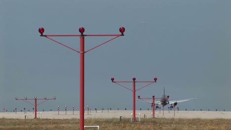 a jet airplane lands on an airport runway 2