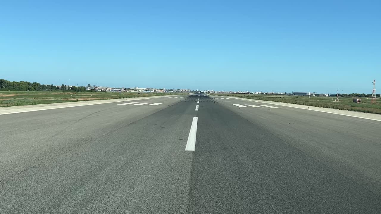 A pilot&rsquo;s point of view preparing for take-off aligning in runway 12, in a splendid summer afternoon