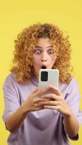 surprised woman looking at phone