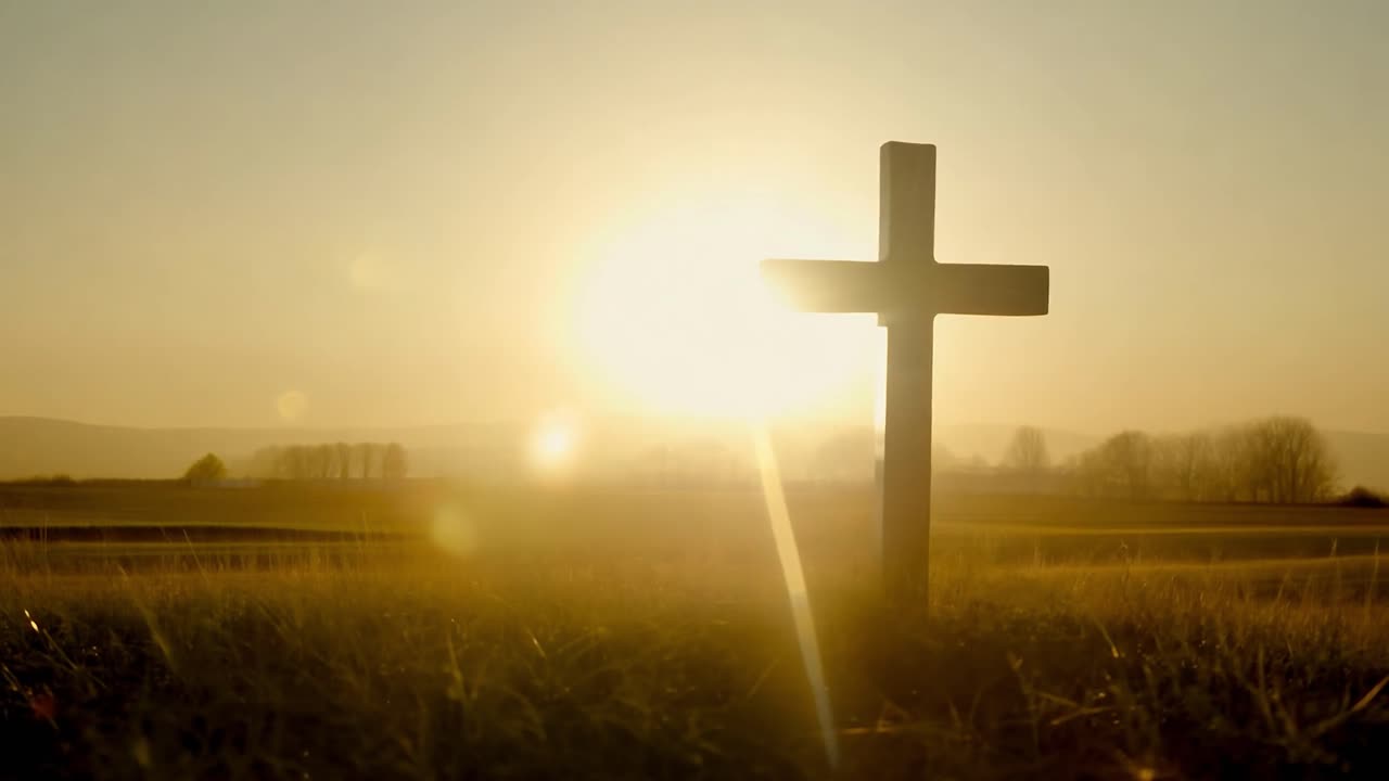Sunrise illuminating a cross in a peaceful field, symbolizing faith and hope in a serene morning landscape