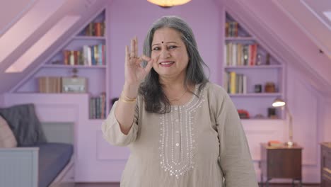 happy indian old woman showing okay sign