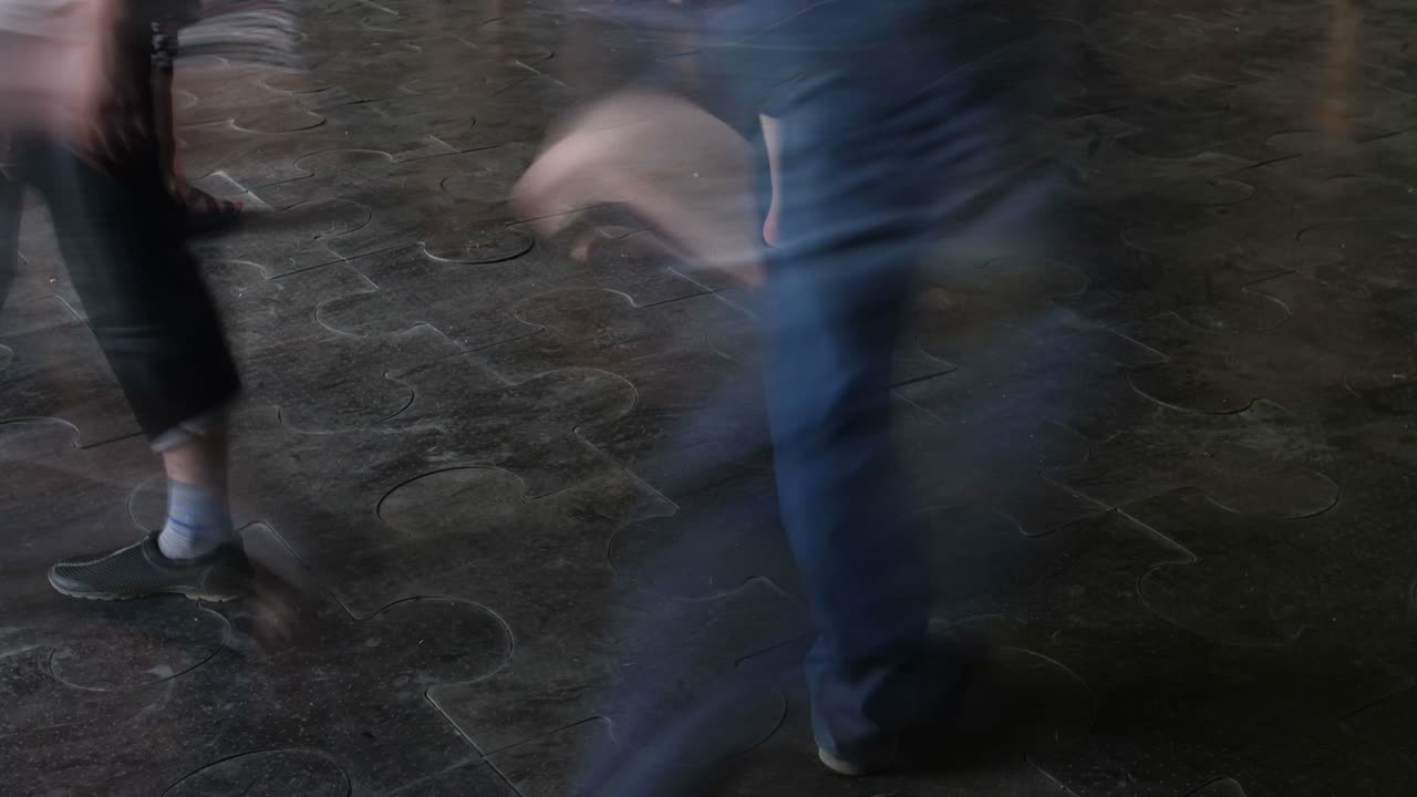 People Walking on a Puzzle Floor