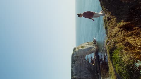 woman on a cliffside