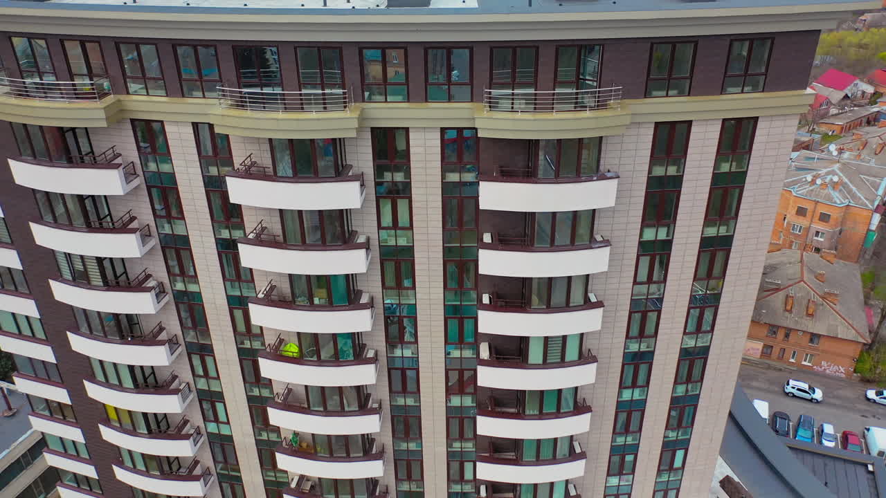 Futuristic architecture cityscape view. Aerial view of facade detail of modern high-rise apartments building