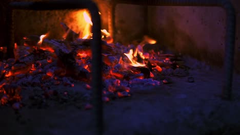 Fire-embers-and-ash-on-a-burning-stone-barbecue