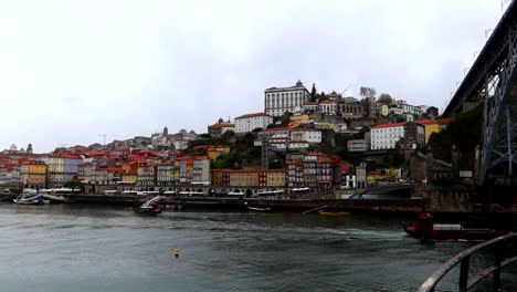 porto views next to douro river seen from vila nova de gaia in cloudy day