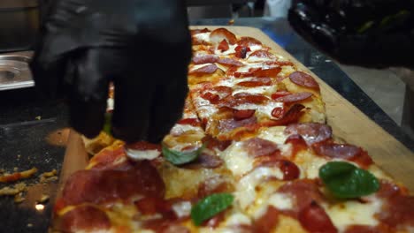 large pepperoni pizza on a wooden board