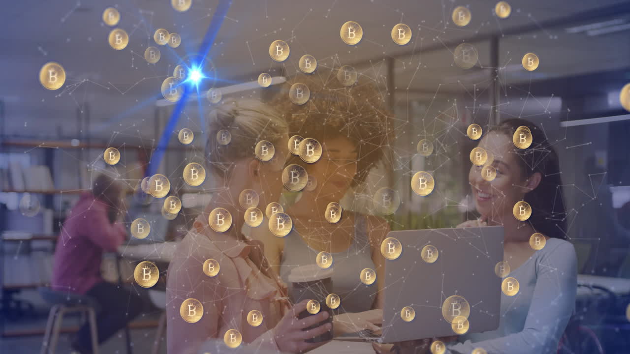 Bitcoin symbols and network animation over diverse women collaborating with laptop