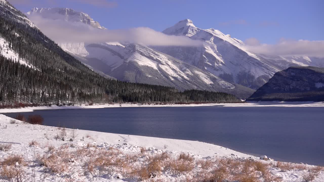 winter timelapse in Kananaskis country with a lake.