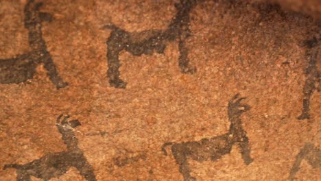 rock paintings of a caravan of llamas