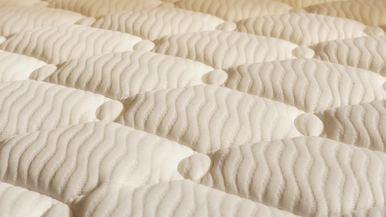 Textura de colchão matelassê branco.