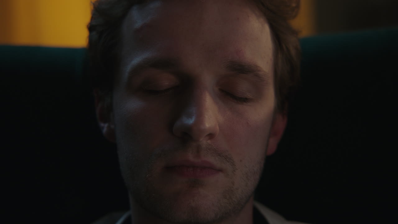 Close-up of a man with closed eyes