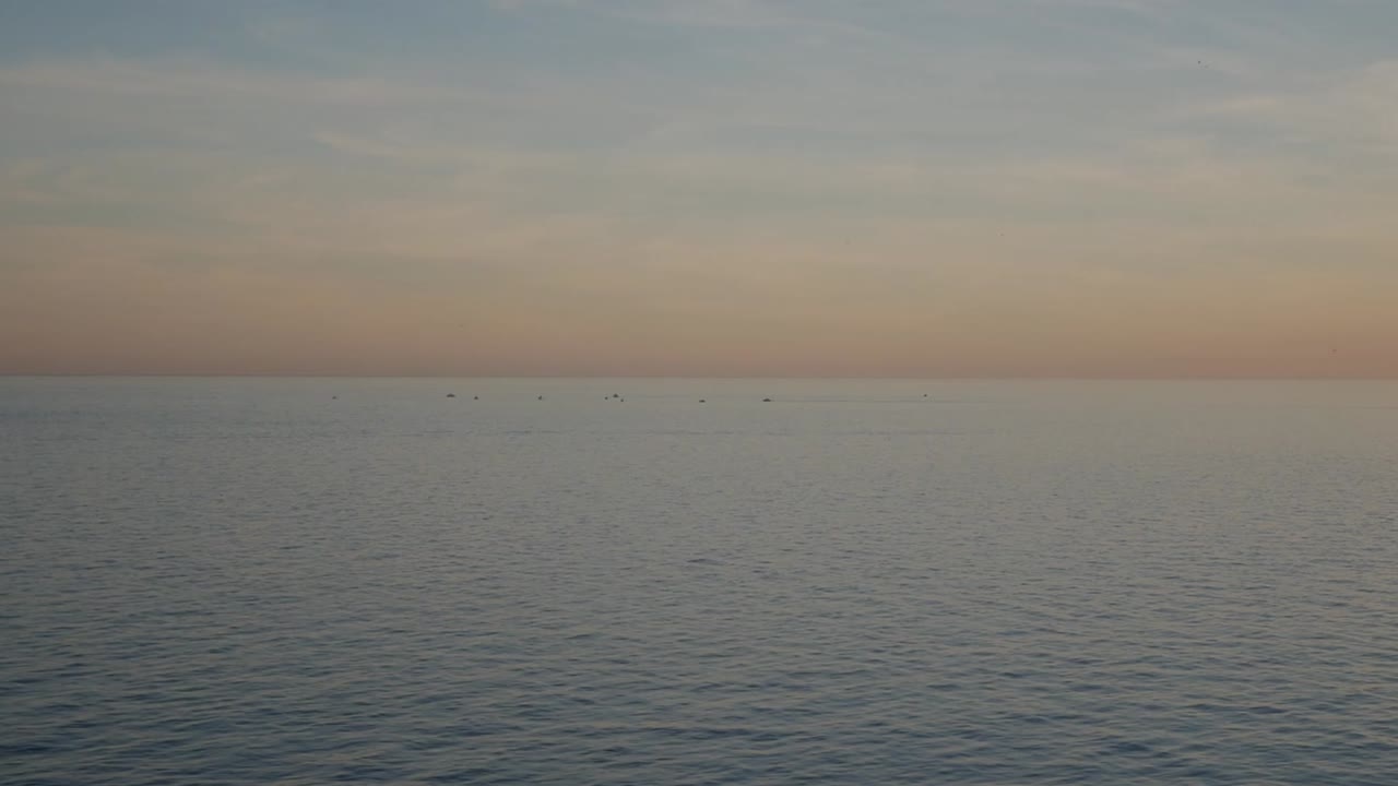 Tranquil seascape of Punta del Bon Nou beach in Alicante, Spain during sunset