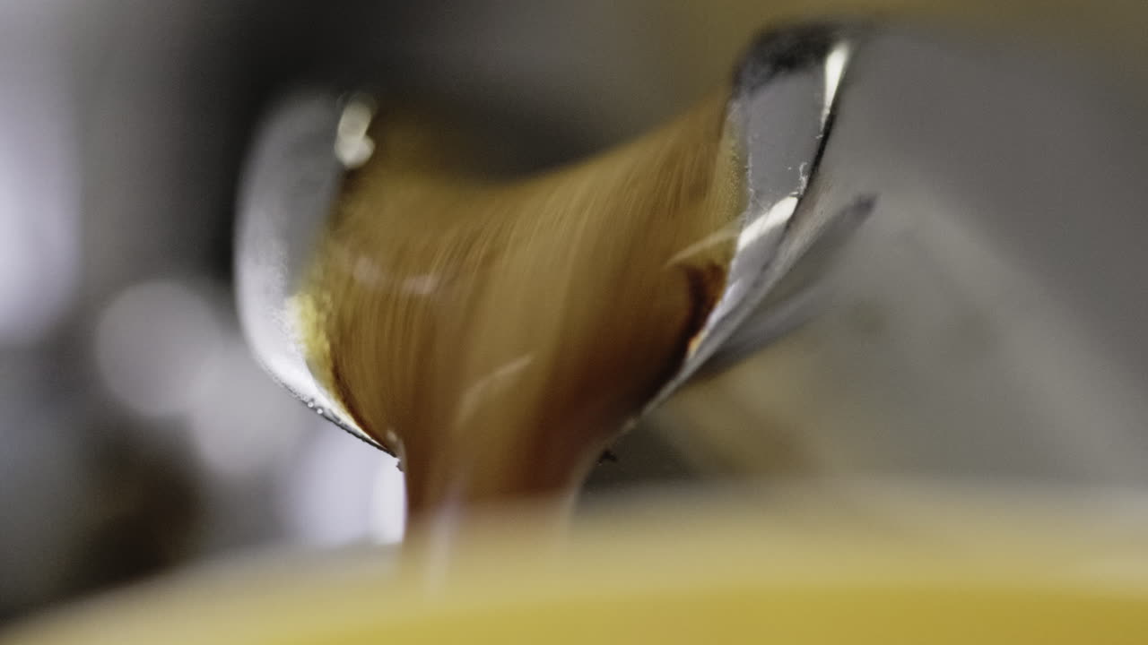 Macro shot of an espresso being pulled out of a machine