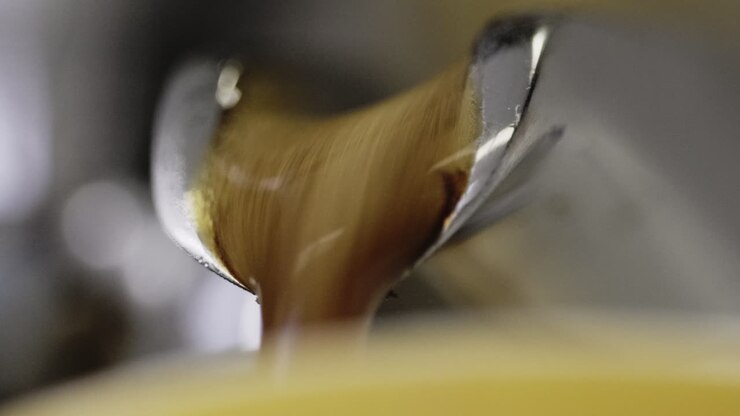 Macro shot of an espresso being pulled out of a machine
