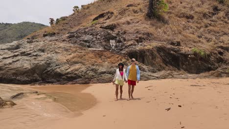 couple walking on a beautiful beach