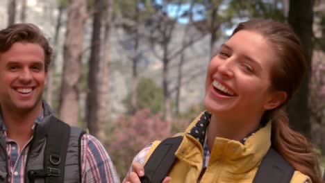 smiling couple on a hike in the countryside