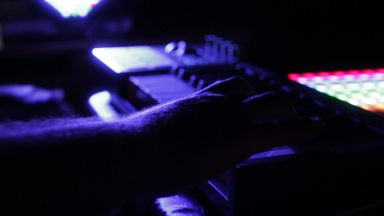 Talented keyboard player demonstrates skills in colorful light show