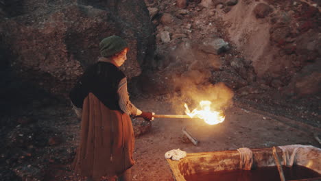 woman with torch walking in dystopian world