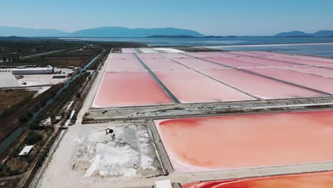 Sea-salt-farm-artificial-basin-infrastructure,-Albanian-mountain-background