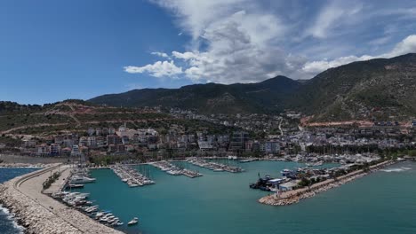 Drone-view-of-boats-from-above-in-a-small-harbor,-view-of-boats-tidily-moored-in-the-harbor