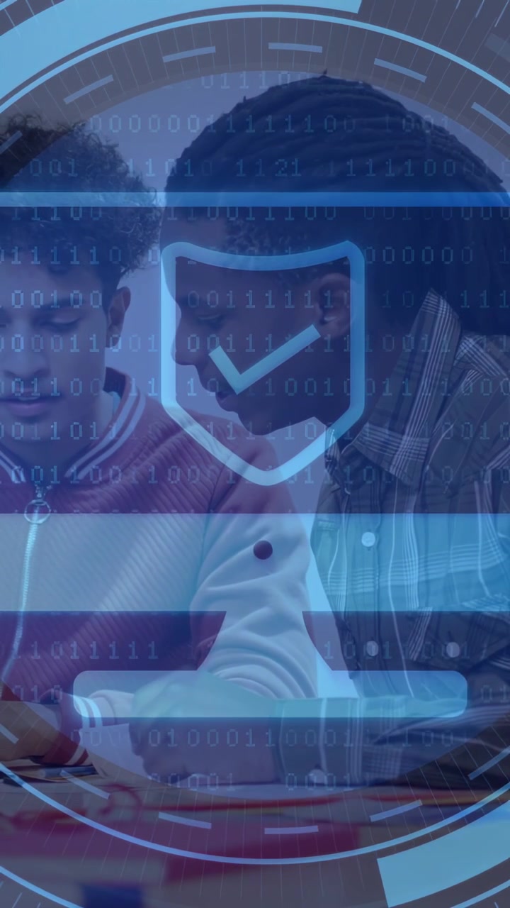 Vertical video: Two male partners assembling circuit, blue HUD overlay growing and verifying build