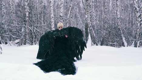 blonde actress in gorgeous phoenix suit in deep snowdrift