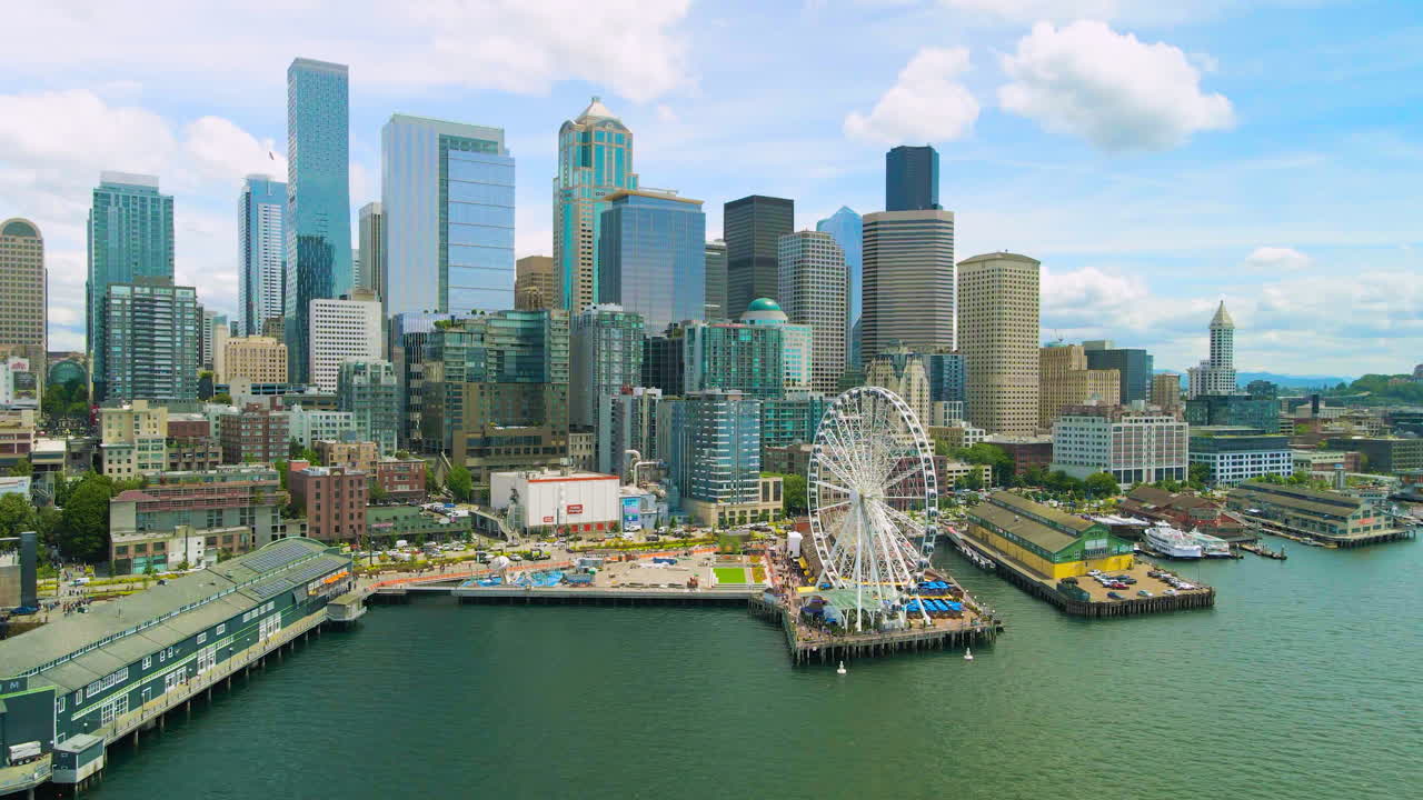 Revealing Drone shot Seattle Downtown, Seattle Waterfront Pier 62 intro and establishing aerial shot. Seattle Aquarium