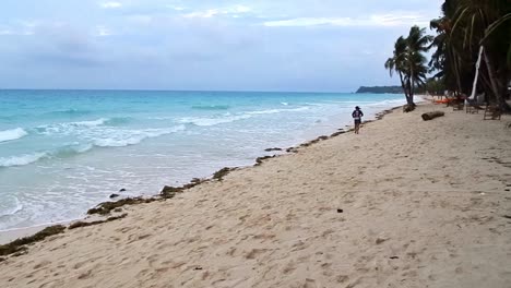 Typical-morning-at-Boracay-Beach,-a-popular-tourist-destination-in-the-Philippines-known-for-its-lovely-weather-and-long-stretches-of-white-sand