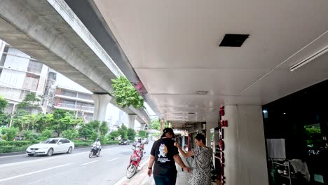 people walking on a busy bangkok street