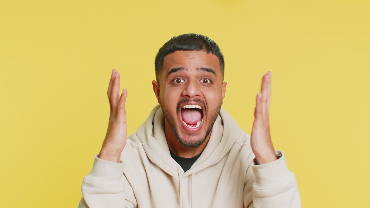 Irritated angry indian man screams from stress tension problems shock rage nervous quarrel