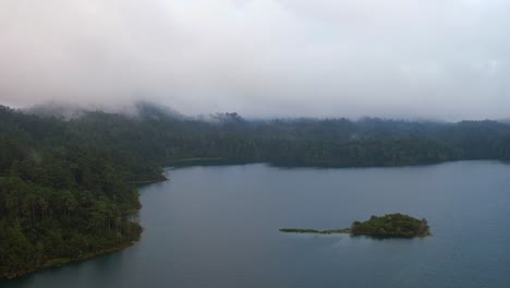 Aerial-shot-of-a-little-island-in-the-Tziscao-Lake,-Montebello-National-Park,-Chiapas