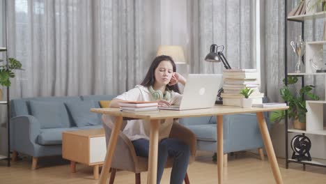 teenage girl studying at home