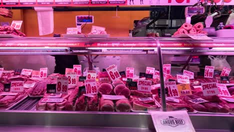 various meats displayed at a market stall