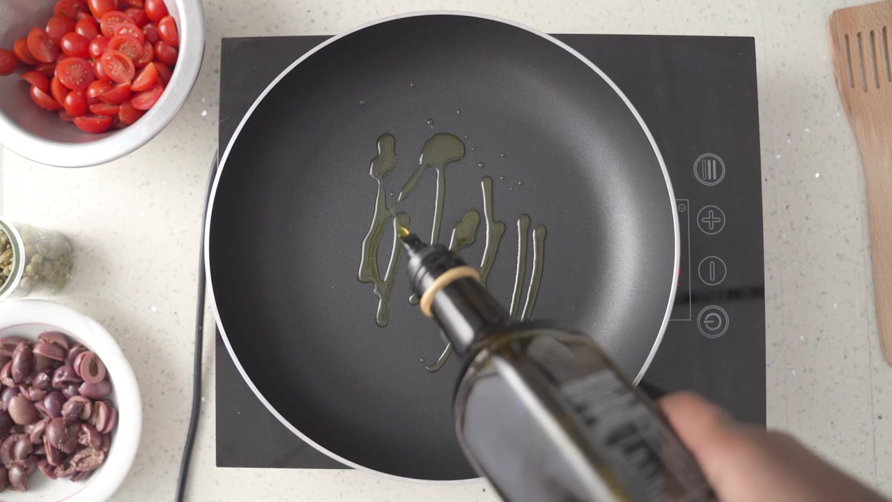 Pouring Oil into a Pan