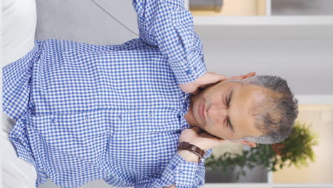 Vertical-video-of-Man-with-neck-pain.