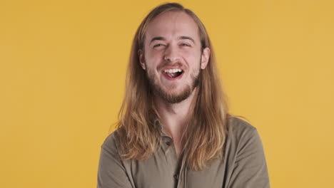 caucasian young man smiling at the camera.