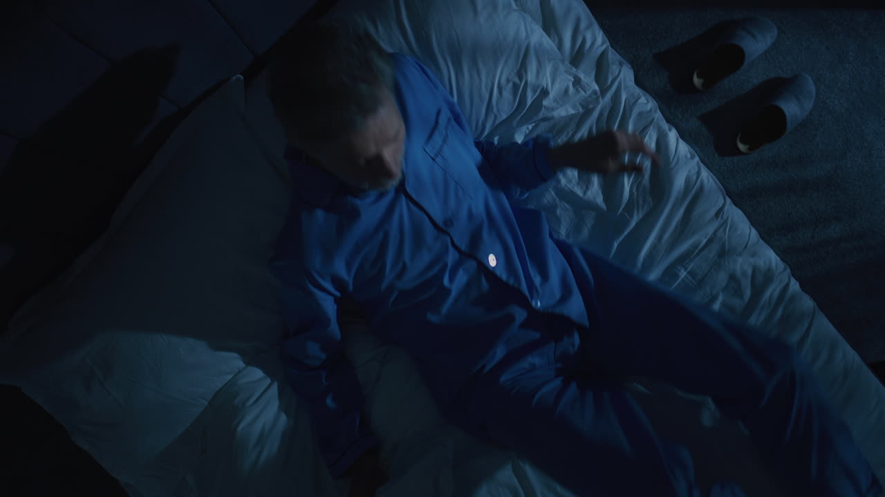 Handsome Gray Haired Man Prepares For Bed