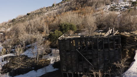 abandoned, destroyed house in ghost town of eureka, utah - aerial