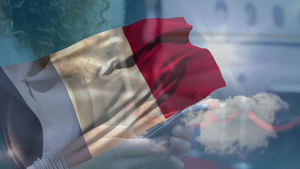 Holding tablet with airplane animation, French flag overlaying in sky background