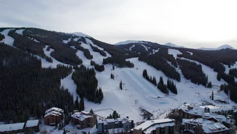 Drone-aerial-views-of-a-ski-resort-halfpipe-feature-on-the-mountain