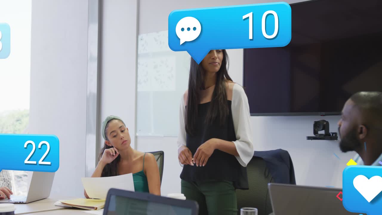 Standing presenter gesturing pen and initiating animated social icons, showing marketing engagement