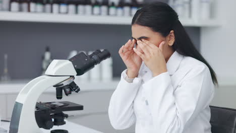 exhausted and tired woman analyzes test sample