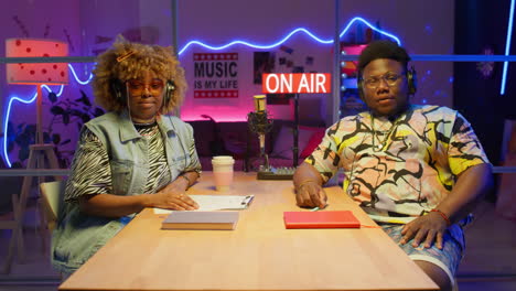 two people doing a radio show