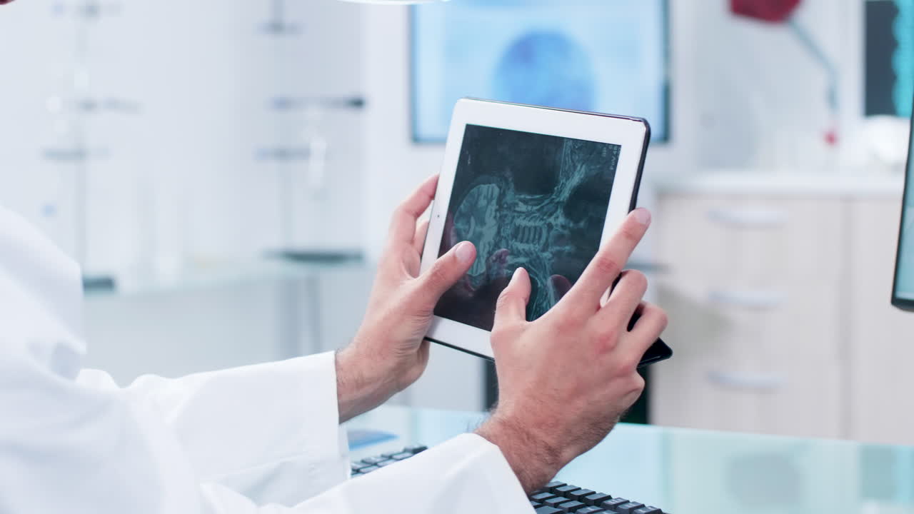 Doctor reviewing medical imaging on a tablet