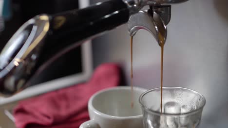 espresso pouring from coffee machine