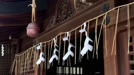 Traditional-Japanese-shrine-with-straw-rope-and-white-paper-streamers