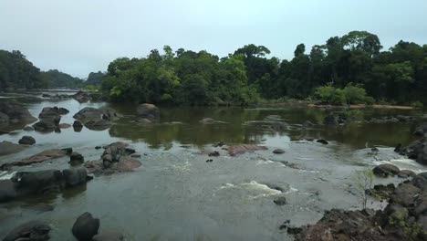 Suriname-River-rapids-flowing-over-rocks,-tropical-rainforest,-aerial-view