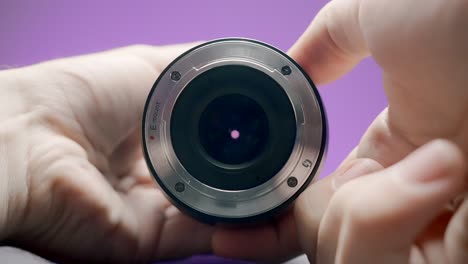 close-up of a camera lens in hands