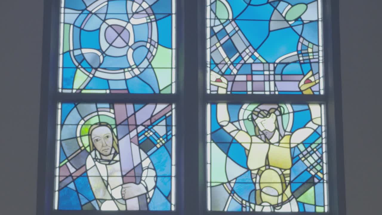 Colorful stained glass window, Stations of the Cross and Crucifixion of Jesus Christ